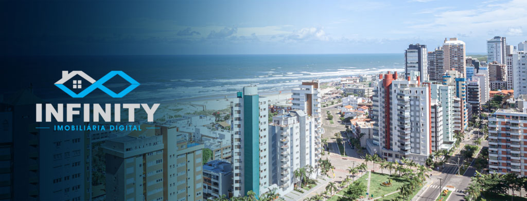 Prédios e casas próximos a uma praia em Torres, no Rio Grande do Sul, com a logo da Infinity Imobiliária Digital à esquerda.